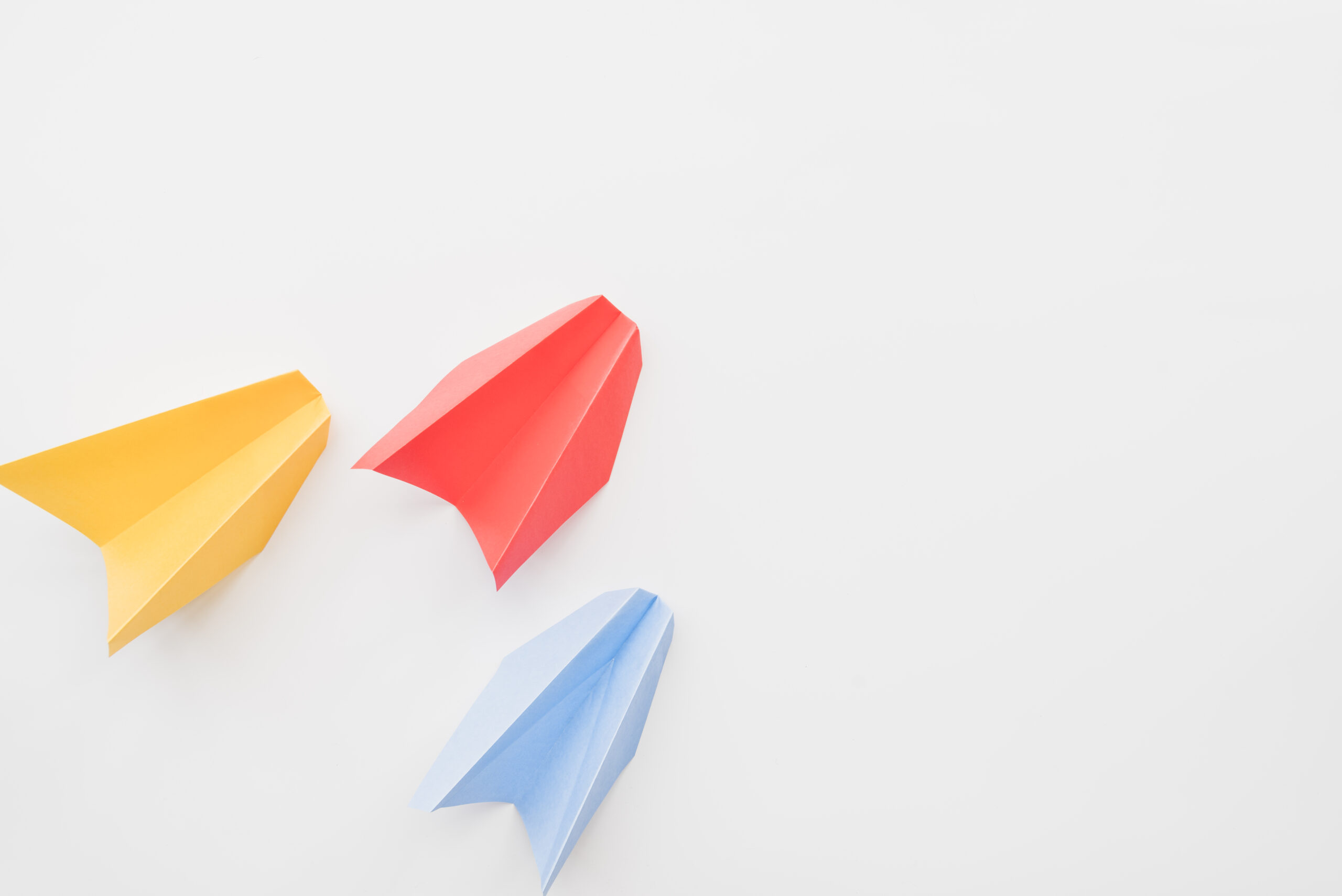 different-colored-paper-planes patrick-tomasso